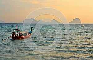 Small boats in the ocean at dusk, Thailand