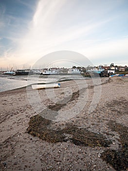 Small boats parked on beach front sky clouds ocean bay