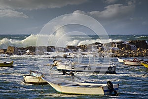 Small boats in the rough sea