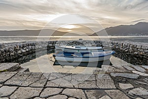 Small boats tied in little marina of Tivat harbor