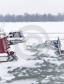 Small boats trapped in ice on river Danube