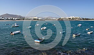 Small boats in tropical ocean bay