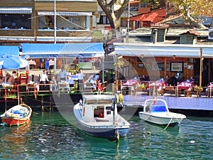 Small boats by waterside restaurants photo
