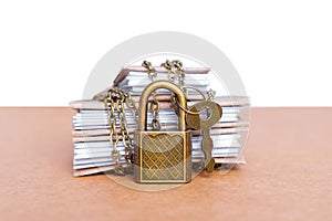 Small books secured with chain and padlock