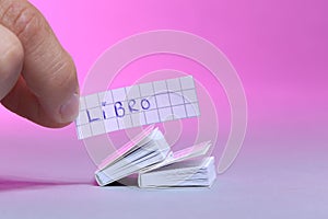 Small books, white background. Libro is the Spanish word photo