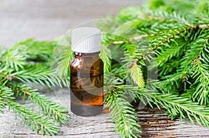 Small bottle with essential black spruce oil. Aromatherapy, homemade spa, beauty treatment and herbal medicine