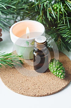 Small bottle with essential pine oil. Aromatherapy, herbal medicine, natural skin care, homemade spa