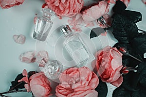 Small bottle of perfumes with flowers