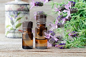 Small bottles with essential lavender oil extract, tincture, infusion, perfume. Aromatherapy, spa and herbal medicine