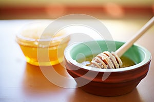 a small bowl full of honey - a natural sugar substitute