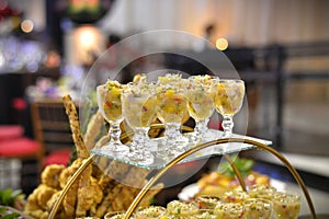 Small bowls with ceviche decorating the party table photo