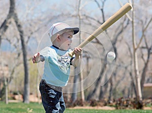 Small boy with bat and ball