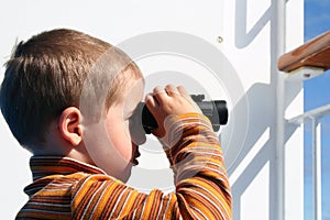 Small boy with binoculars