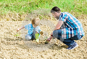 Small boy child help father in farming. new life. soils and fertilizers. happy earth day. Supporter of environment