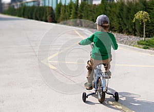 Small boy cycling on bike