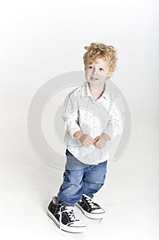 Small boy in dad's big shoes