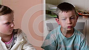 Small boy and girl have a snack.The siblings eat chocolate cream spread on roll. Family concept.