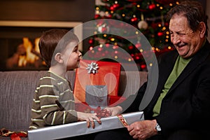 Small boy helping grandfather