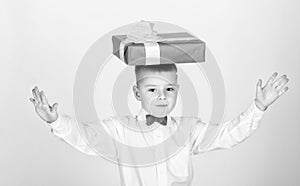 Small boy hold gift box. Christmas or birthday gift. Dreams come true. Buy gifts. Happiness and positive emotions