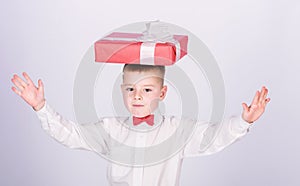 Small boy hold gift box. Christmas or birthday gift. Dreams come true. Buy gifts. Happiness and positive emotions