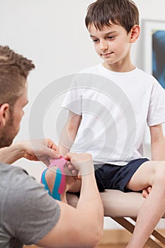 Small boy during kinesiology therapy