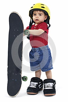 Small Boy with Large Helmet Shoes and Skateboard