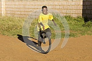 Small Boy Playing with Tyre