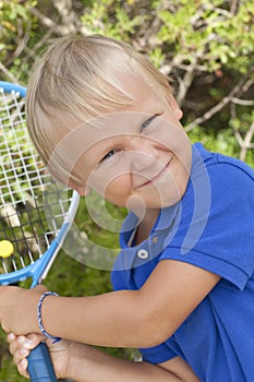 Small boy with tenis raket