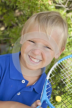 Small boy with tennis raket