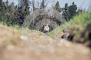 Small boy walking in mountainous countryside