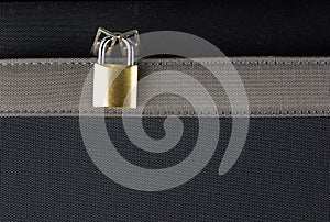 Small Brass Padlock on a Zippered Suitcase Pocket