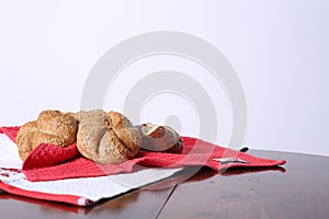 Small bread over a red and white cloths