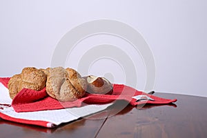 Small bread over a red and white cloths