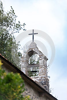 Small Breton chapel bell tower and cross