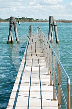 Small bridge over blue laguna water