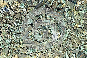 Small broken glass and construction debris. Fragments of a broken kinescope and monitor. The background for the design