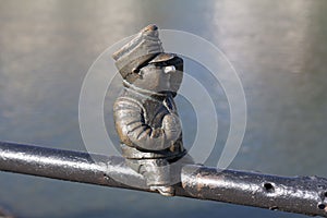 Small bronze statue of Good Soldier Svejk attached to the handrails at Kyivska embankment of the river Uzh in Uzhgorod Ukraine pho photo