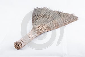 Small broom on white background