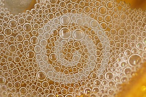 Small bubbles on a golden background. beer bubbles