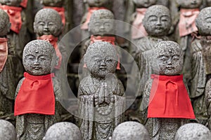 small buddha statues called Bodhisattva, in a temple in japan photo