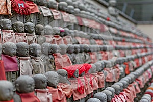 small buddha statues called Bodhisattva, in a temple in japan photo