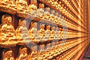 Small buddhas on a wall