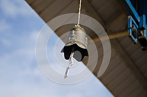 Buddhist bell under the roof of the temple