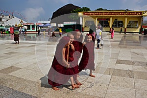 Small Buddhist Monk laughing and talking seem to be happy with simple life