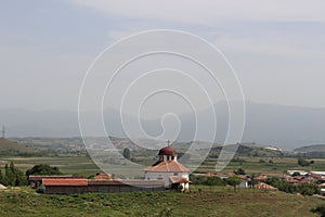 A small Bulgarian village part of it, the church against the backdrop of a natural landscape