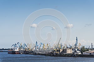 Small bulk carrier ship loading coal Riga