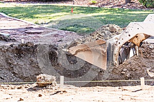 Small Bulldozer Digging In Yard For Pool Installation