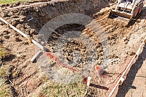 Small Bulldozer Digging In Yard For Pool Installation