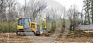 Small Bulldozer Grading Land