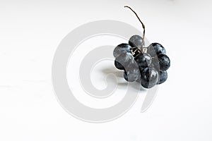 Small bunch of black round grapes